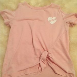 pink tee with sleeve cutouts